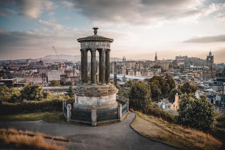 Captivating view from Calton Hill in Edinburgh showcasing historic architecture at sunset.